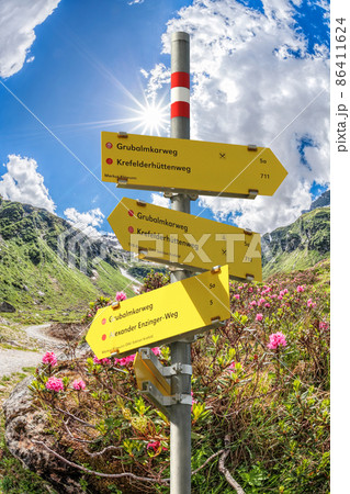 Signpost against spring Alps, Zell am See-Kaprun region, Austria 86411624