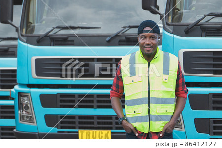 African Young Man owner Truck Driver happy Smiling confident near lorry. African Young Man owner Truck Driver happy Smiling confident near lorry. 86412127