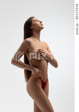 Topless woman in lingerie in studio Topless woman in lingerie in studio 86415948