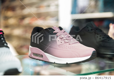Counter with sports shoes in a store Counter with sports shoes in a store 86417915
