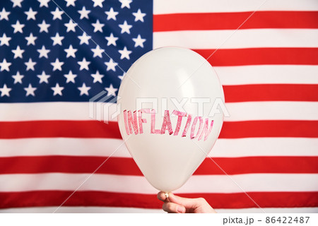 World inflation concept. Balloon with word inflation against usa flag World inflation concept. Balloon with word inflation against usa flag 86422487