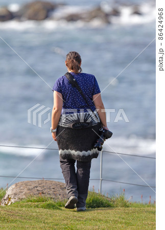 Woman in traditional Icelandic sweater enjoying the Icelandic landscape Woman in traditional Icelandic sweater enjoying the Icelandic landscape 86424968