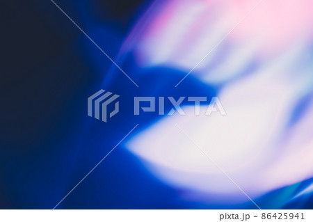 Defocused glow overlay. Blur flare. Radiance reflection. Bokeh neon blue white pastel pink color light abstract pattern on dark background. Defocused glow overlay. Blur flare. Radiance reflection. Bokeh neon blue white pastel pink color light abstract pattern on dark background. 86425941