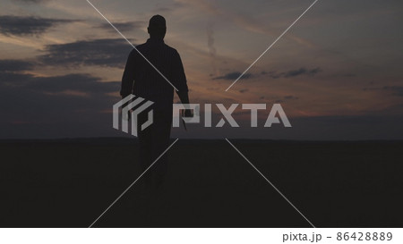 silhouette of farmer with shovel field, agriculture, gardening business spring work, summer sunset on rural land, harvest time, man gardener goes dig land on plantation, work soil farm agronomist silhouette of farmer with shovel field, agriculture, gardening business spring work, summer sunset on rural land, harvest time, man gardener goes dig land on plantation, work soil farm agronomist 86428889