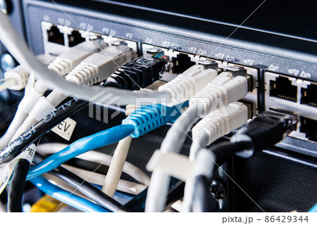 colorful patch cables connected to switch - high speed internet concept 86429344