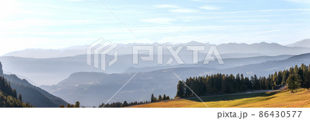 Panoramic landscape of Val Gardena mountains, view from Seiser Alm plateau Panoramic landscape of Val Gardena mountains, view from Seiser Alm plateau 86430577