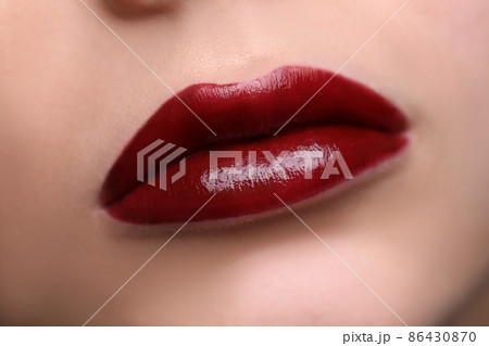 Closeup of beautiful female lips with red lipstick 86430870