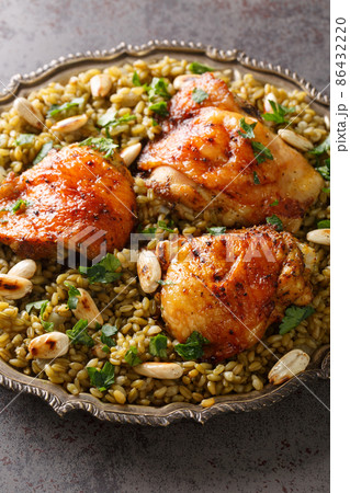 Freekeh With Chicken, Almonds popular Lebanese food close-up in a plate. vertical Freekeh With Chicken, Almonds popular Lebanese food close-up in a plate. vertical 86432220