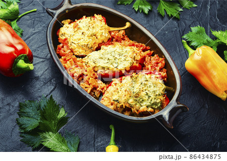 Roasted bell peppers stuffed with rice and meat 86434875