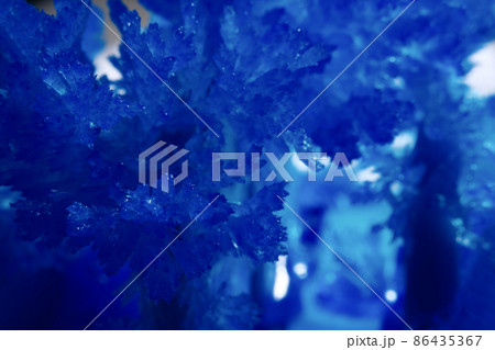 Closeup of blue shiny crystal abstract background Closeup of blue shiny crystal abstract background 86435367