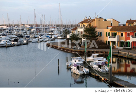 apartments at a sea harbour in the sunset 86436250