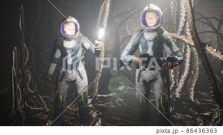 Astronauts on an alien planet find themselves in a cave with alien nightmare creatures. The concept of colonizing unexplored planets. The image is perfect for sci-fi or space backgrounds. 3D Rendering 86436363