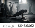 Sportsman Do Exercises at Big Dark Gym . 86436862