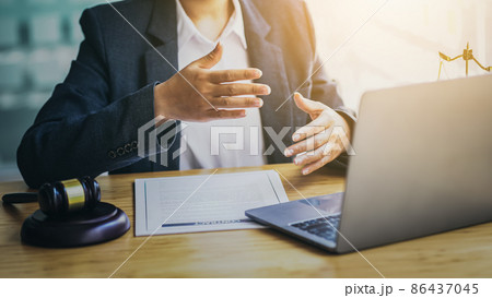 Lawyers consult online via video conferencing system by laptop. Lawyers consult online via video conferencing system by laptop. 86437045