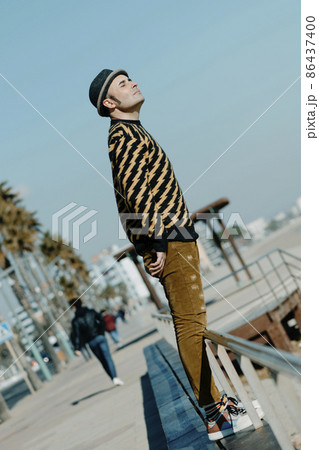 modern middle-aged man standing outdoors modern middle-aged man standing outdoors 86437400