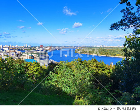 Aerial top view of Kyiv cityscape, Dnieper river and Podol historical district skyline from above, Kontraktova square with ferris wheel, city of Kiev, Ukraine. Aerial top view of Kyiv cityscape, Dnieper river and Podol historical district skyline from above, Kontraktova square with ferris wheel, city of Kiev, Ukraine. 86438398