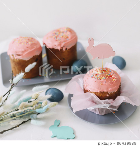 Easter cakes with decorations, colorful eggs and willow branches. Happy Easter holiday concept. 86439939