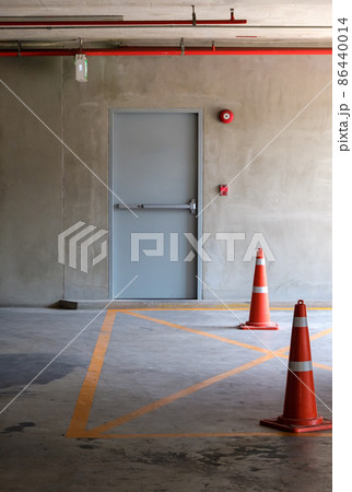 The fire exit door for the emergency case of the parking building. The fire exit door for the emergency case of the parking building. 86440014