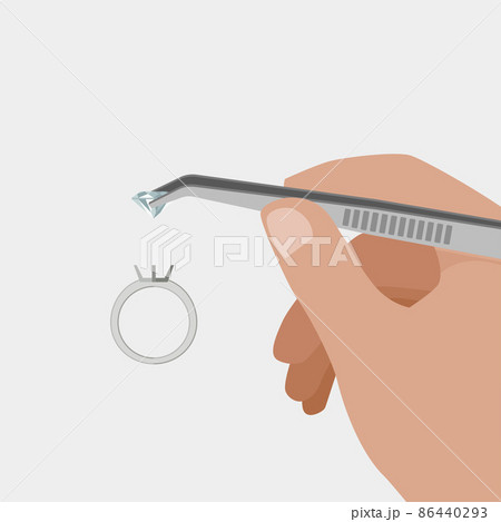 Jeweler at work making a silver ring. 86440293