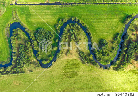 Aerial view on winding river in rural landscape 86440882