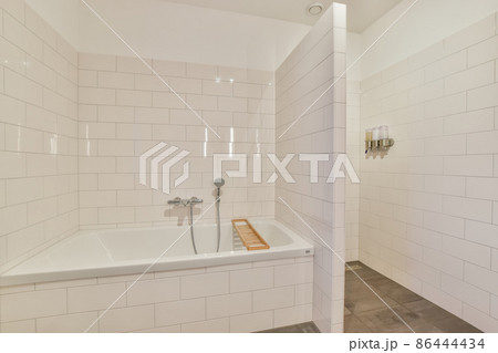 Luxury interior design of a bathroom with marble walls Luxury interior design of a bathroom with marble walls 86444434