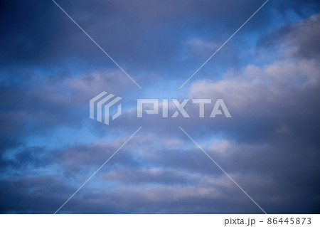 Blue sky shrouded in gray dark clouds 86445873