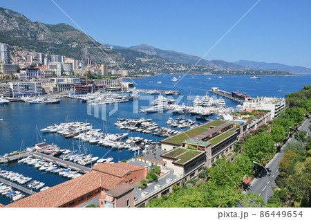 Rich yachts in the bay at day time. Rich yachts in the bay at day time. 86449654