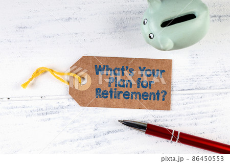 Whats Your Plan for Retirement. Cardboard price tag and piggy bank on a wooden table 86450553