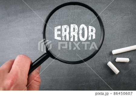 Error concept. Magnifying glass in a man's hand. chalk board background Error concept. Magnifying glass in a man's hand. chalk board background 86450607