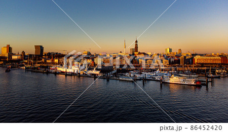 Sunset over Hamburg harbour - aerial view 86452420
