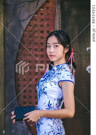 Asian woman in traditional Chinese dress or Qipao Asian woman in traditional Chinese dress or Qipao 86454931