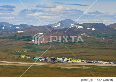 Summer aerial view of the air town and the runway of the arctic airfield 86460646