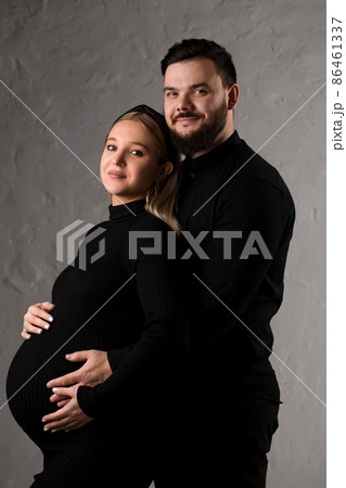 Portrait of a couple expecting a baby Portrait of a couple expecting a baby 86461337