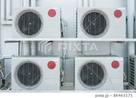 Group of air compressors outside the industry building wall. Air compressors installed in the factory. 86463575