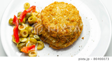 Cod and prawns red Thai style fish cake served with pickled olives, gherkin, garlic, and red peppers 86466073