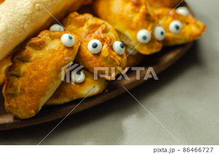 Mini pasties with decorating eyes, succulent pork, turkey, bacon and cranberry all wrapped in shortcrust pastry Mini pasties with decorating eyes, succulent pork, turkey, bacon and cranberry all wrapped in shortcrust pastry 86466727