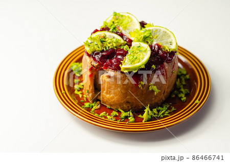 Seasoned British pork, wrapped in crisp, flavoursome pastry served with  beetroot and orange chutney on top 86466741