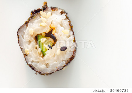 Closeup of  cucumber and wasabi hosomaki roll, traditional Japanese food 86466785