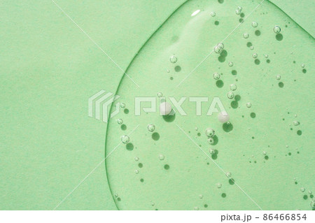 Green cosmetic textured gel background with bubbles. Copy space. Aloe vera gel 86466854