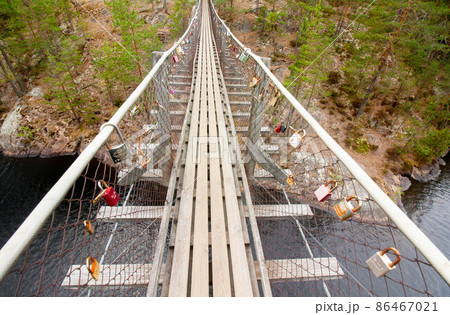Rope bridge in the National Park Repovesi, Finland. Rope bridge in the National Park Repovesi, Finland. 86467021