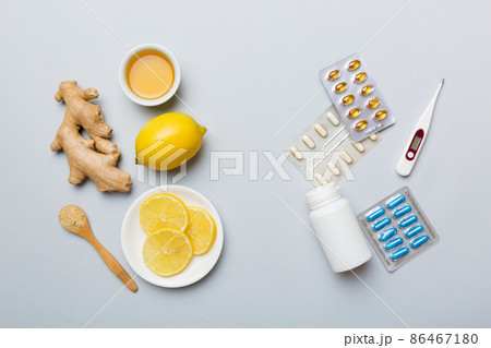 Natural cold and flu home remedies. Natural ingredients for immunity stimulation and viruses protection. top view flat lay Natural cold and flu home remedies. Natural ingredients for immunity stimulation and viruses protection. top view flat lay 86467180