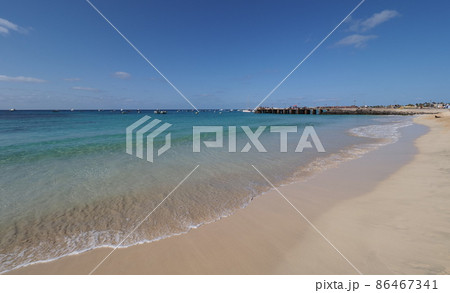 Sandy seaside with boats on Atlantic Ocean at Sal island, Cape Verde Sandy seaside with boats on Atlantic Ocean at Sal island, Cape Verde 86467341