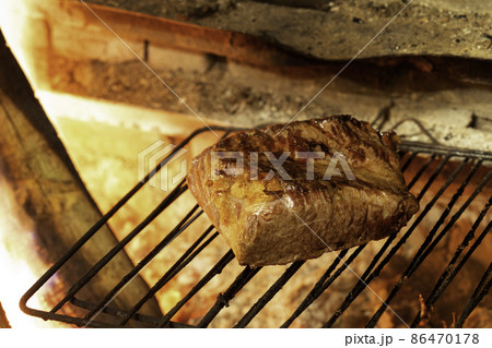 Tasty beef fillet steak on a grill Tasty beef fillet steak on a grill 86470178