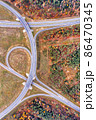 Aerial view on a circular road intersection 86470345
