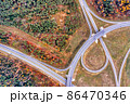 Aerial of highway road through autumn forest 86470346
