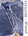 Aerial view on a frozen pond covered in ice 86470353