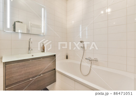 Luxury interior design of a bathroom with marble walls Luxury interior design of a bathroom with marble walls 86471051