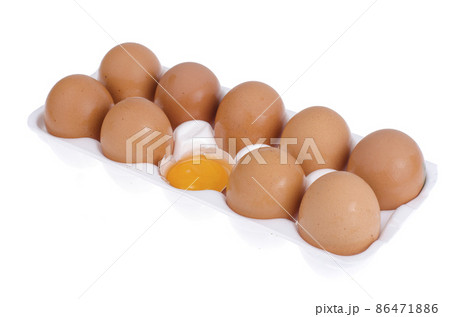 Chicken brown eggs and egg yolk in white form. Chicken brown eggs and egg yolk in white form. 86471886