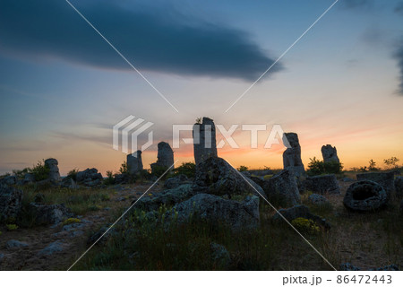 Beautyful sunrise over The Stone Desert Pobiti Kamani - fabulous rock phenomenon in Varna Province, Bulgaria - tourist destination 86472443