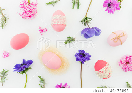 Ester composition with pink eggs, spring flowers and leaves of lavender on white Ester composition with pink eggs, spring flowers and leaves of lavender on white 86472692